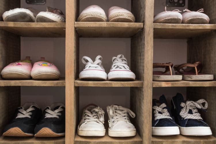 cubby divider guides kids to return shoes to the correct slot