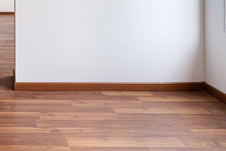 dark stained solid wood baseboards are hard to beat