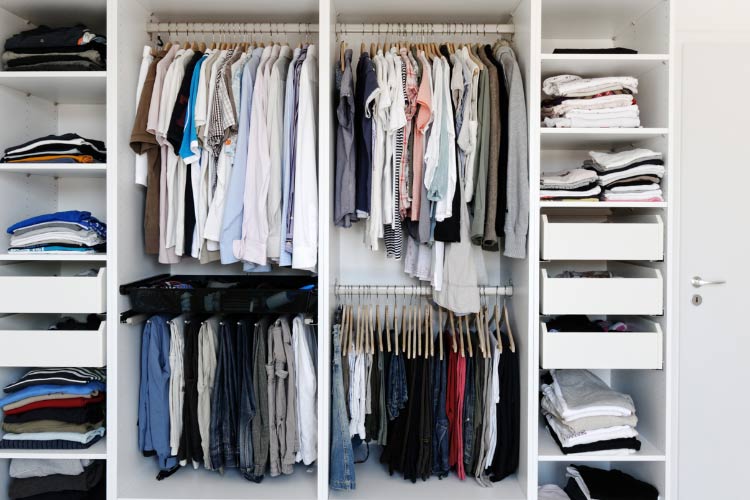 place a tension rod below the existing one for shirts or folded pants