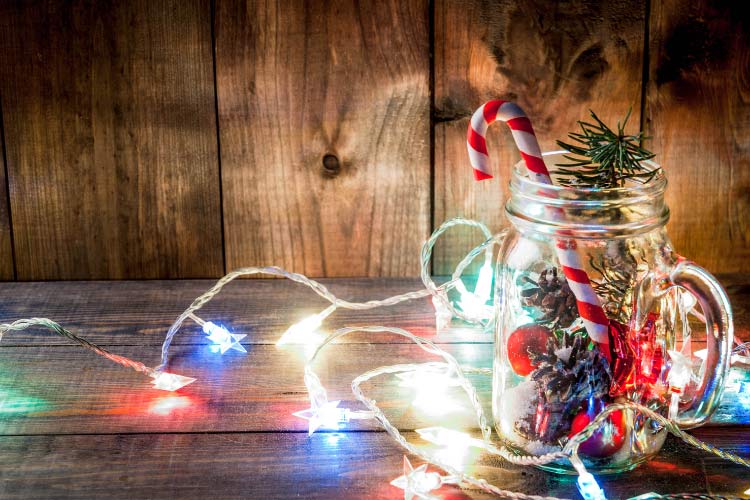 Mason jars are just as effective and you can fill them with fairy lights paired with pine branches