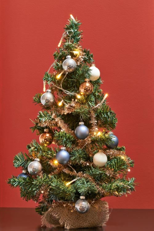  the mantel is the perfect place to display mini trees