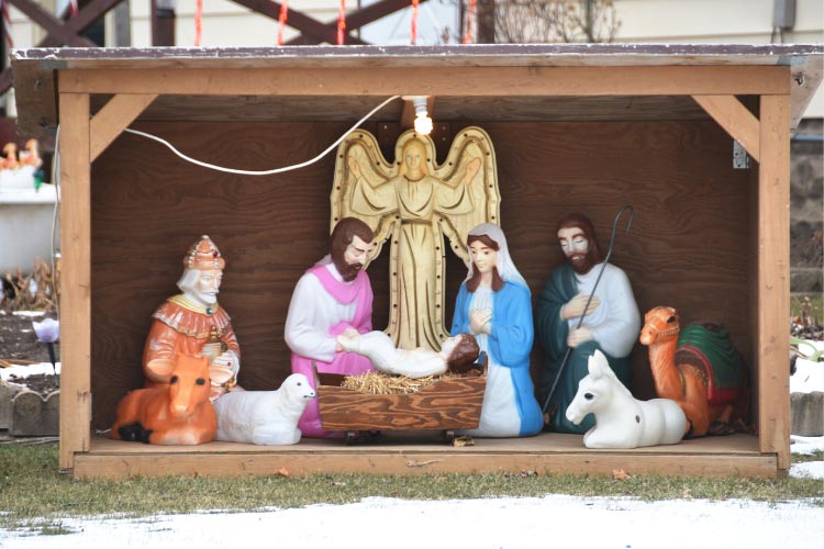 The porch is the perfect place to showcase your very own nativity scene